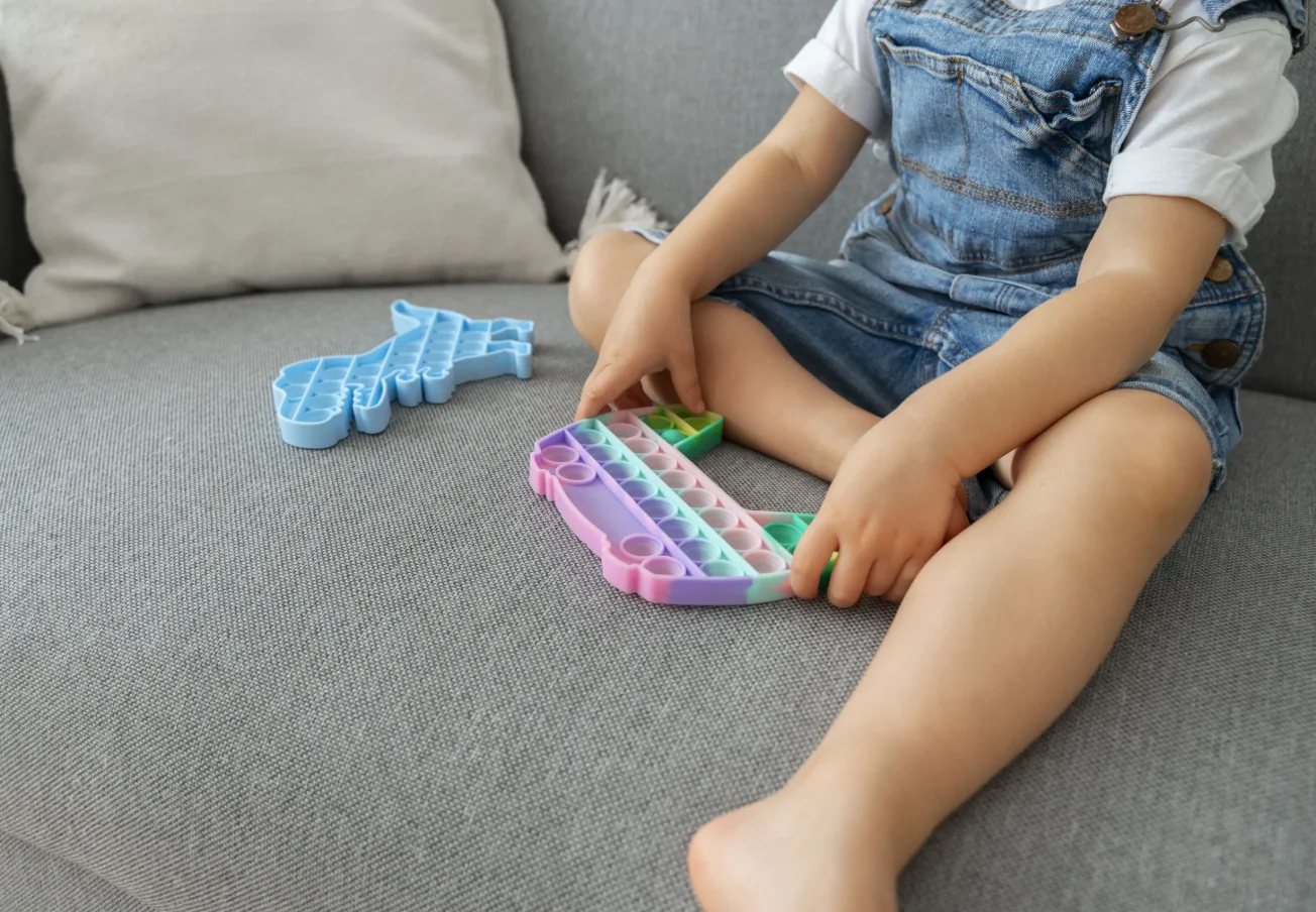 young-kid-playing-with-fidget-home